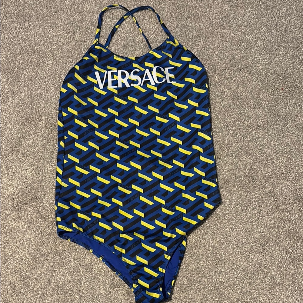 Versace swimsuit 
Size 14
Can fit women’s xs/s